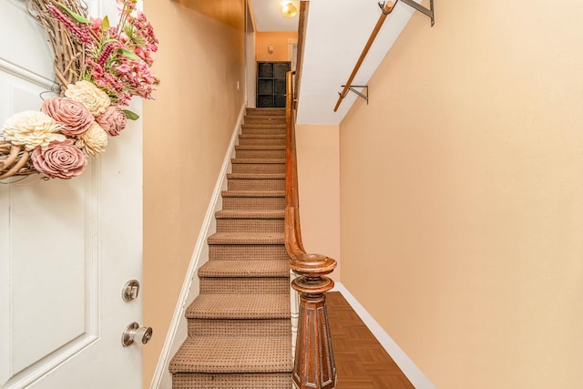 stairs featuring baseboards