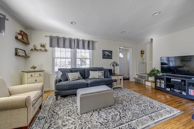 living room featuring recessed lighting, crown molding, stairway, and wood finished floors