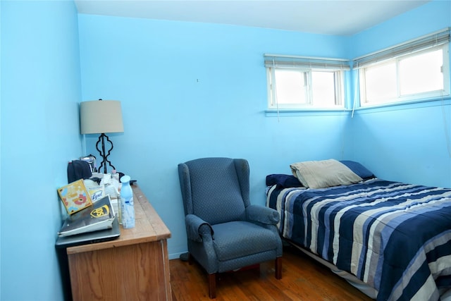 bedroom featuring dark wood-style floors