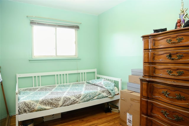 bedroom featuring wood finished floors