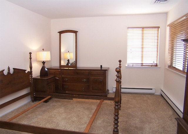 bedroom featuring a baseboard radiator and visible vents