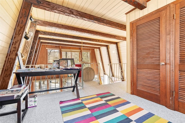 home office with wood walls, wood ceiling, beam ceiling, and carpet flooring