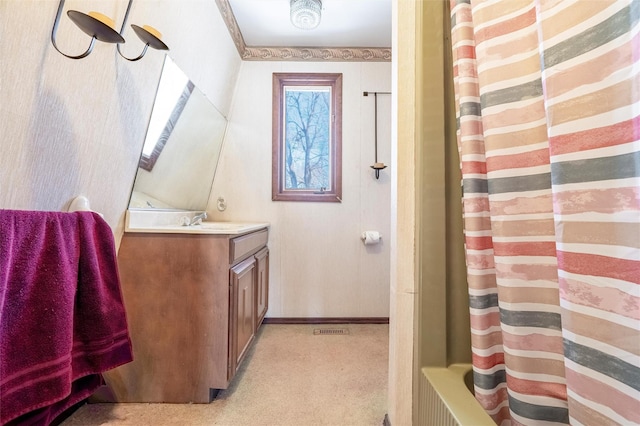 bathroom with vanity and baseboards