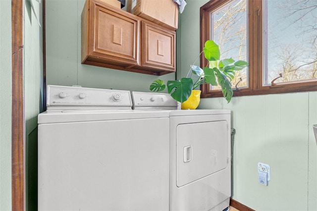 laundry room featuring cabinet space and washer and clothes dryer