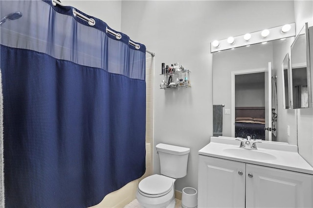 bathroom featuring toilet, curtained shower, connected bathroom, and vanity