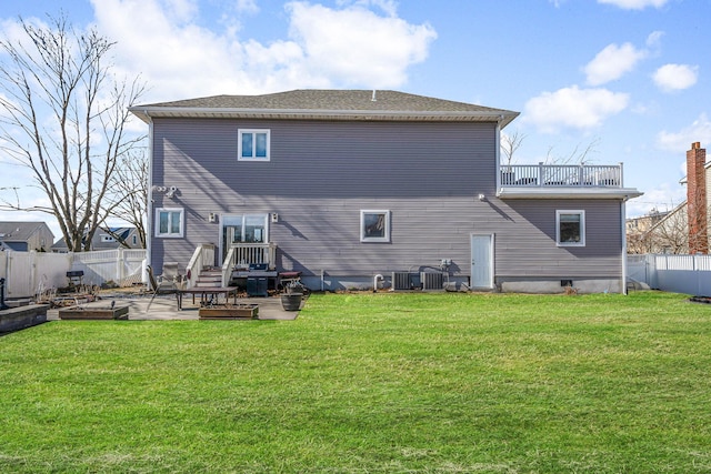 rear view of property with a yard, a fenced backyard, a patio, and central AC