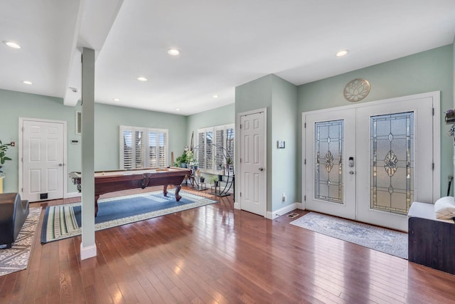 foyer entrance with recessed lighting, billiards, baseboards, french doors, and dark wood finished floors