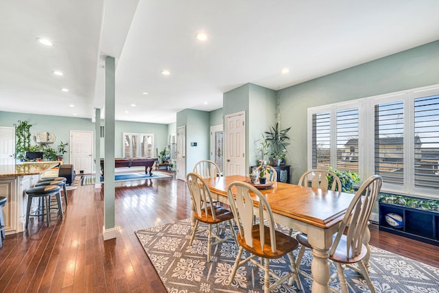 dining space with a healthy amount of sunlight, dark wood-style flooring, and recessed lighting