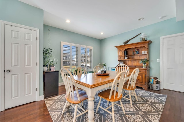 dining room with recessed lighting, dark wood finished floors, and baseboards