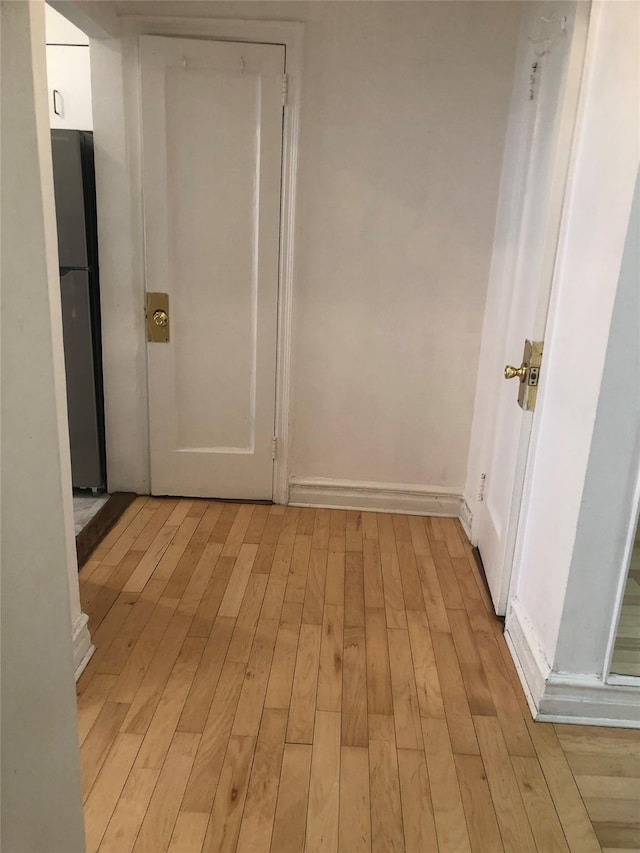 hallway featuring light wood finished floors