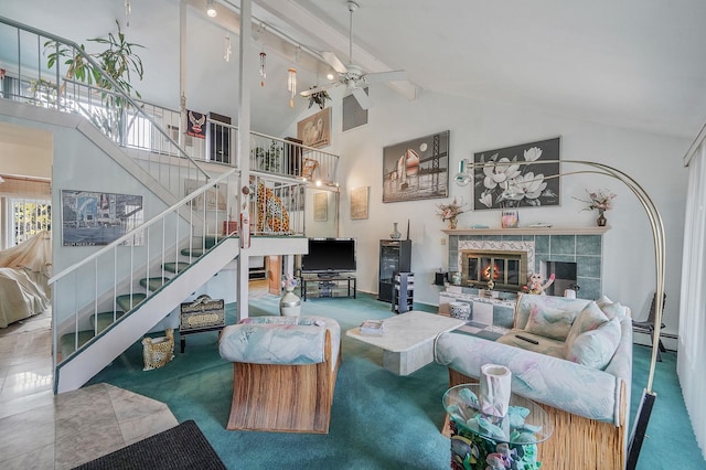 living area featuring a baseboard heating unit, a tile fireplace, carpet, and stairs