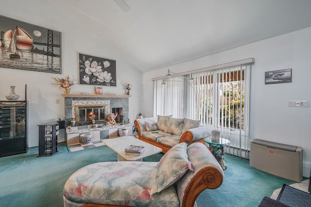 living area with carpet floors, high vaulted ceiling, baseboard heating, and a tile fireplace