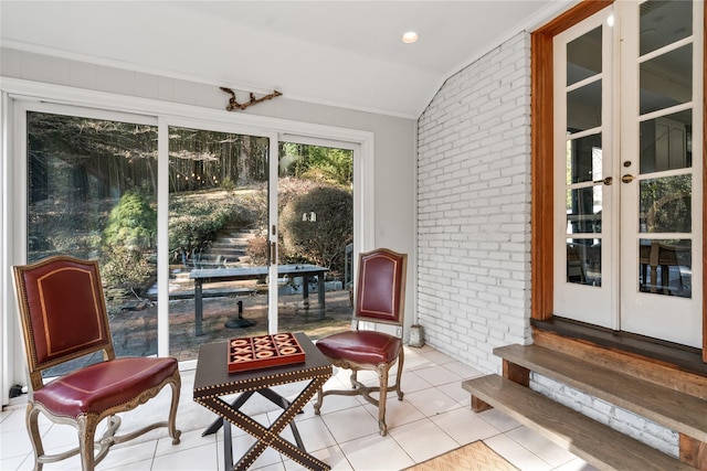 sunroom featuring vaulted ceiling