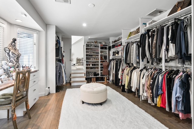 spacious closet featuring visible vents and wood finished floors