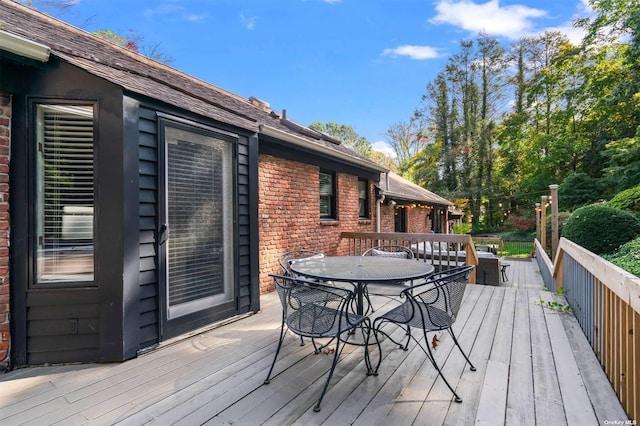 deck featuring outdoor dining area