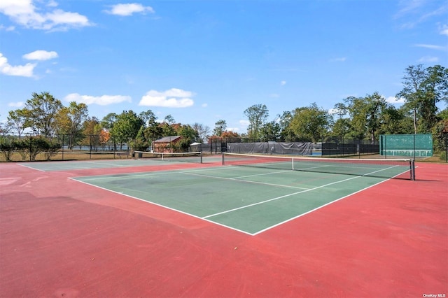 view of sport court with fence