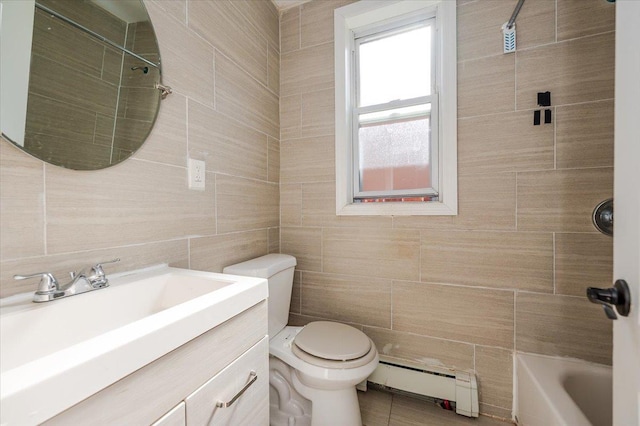 full bath with toilet, a baseboard radiator, vanity, and tile walls