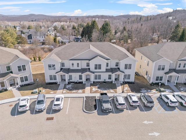 birds eye view of property with a residential view