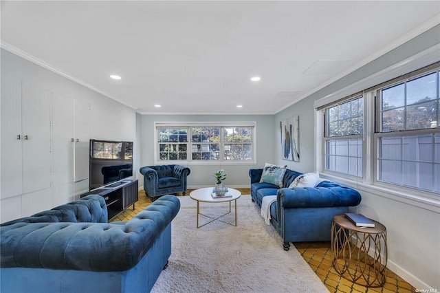 living area featuring a healthy amount of sunlight and crown molding