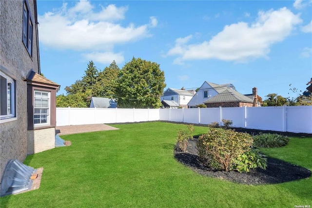 view of yard featuring a fenced backyard