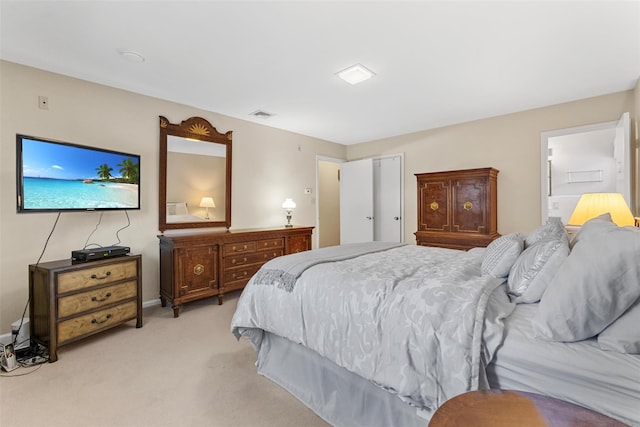 bedroom with light carpet and visible vents