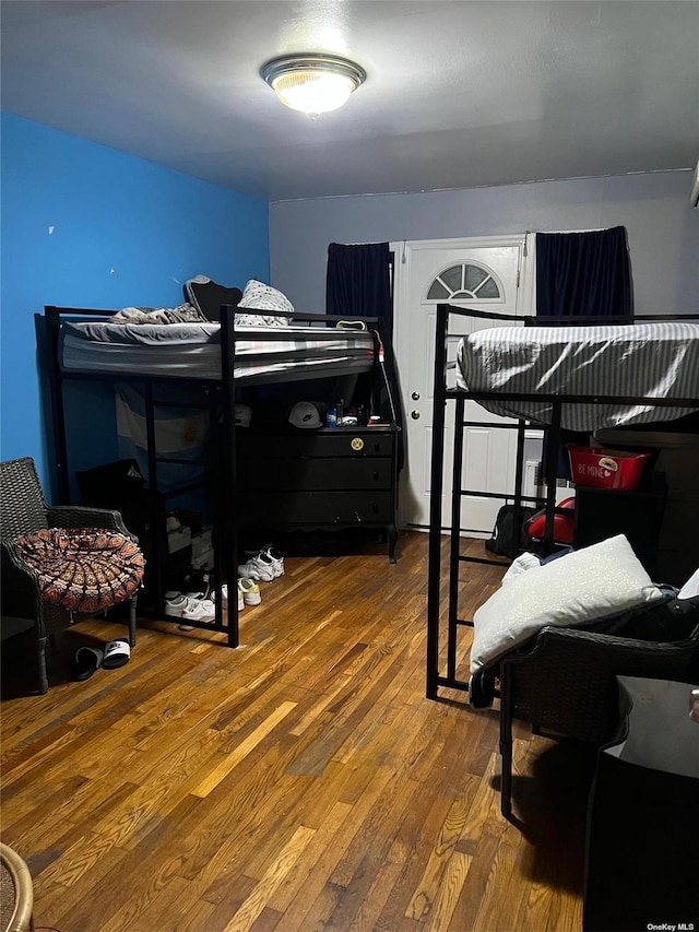 bedroom featuring wood finished floors