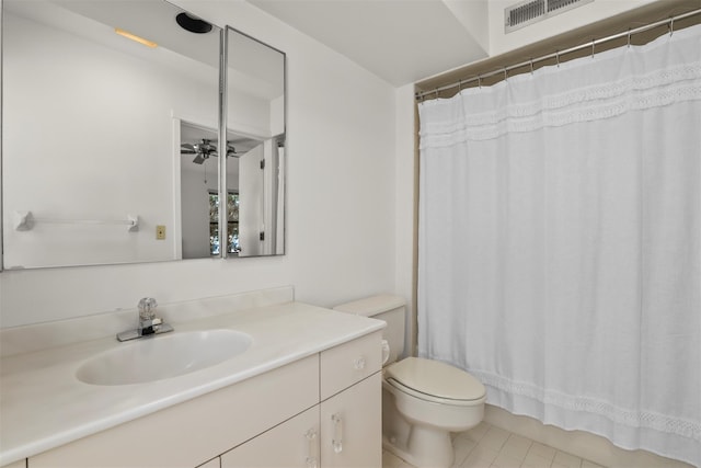 full bathroom featuring visible vents, toilet, a ceiling fan, vanity, and tile patterned floors