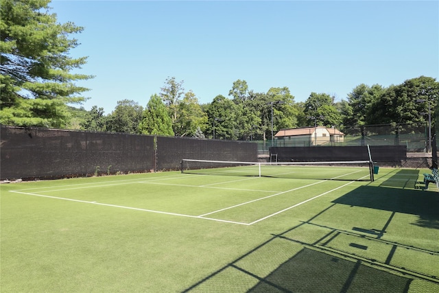 view of sport court with fence