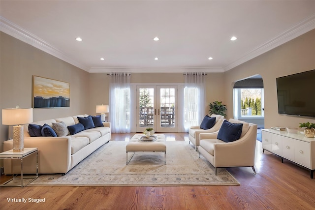 living room with ornamental molding, french doors, wood finished floors, and recessed lighting