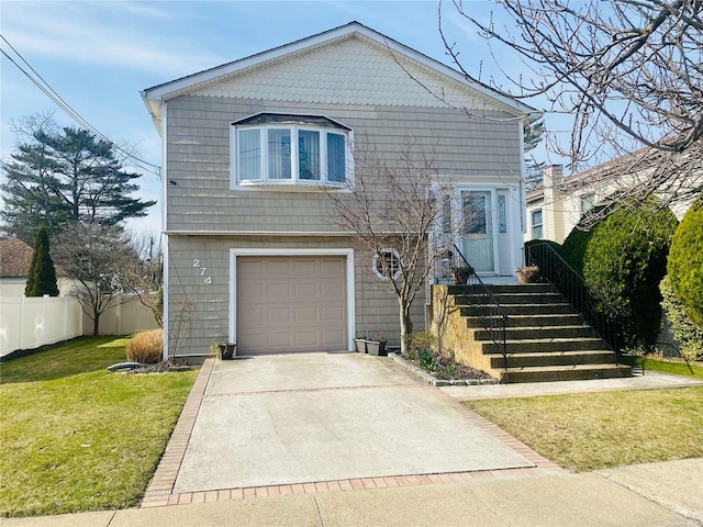 view of front of house featuring a garage, driveway, a front lawn, and fence