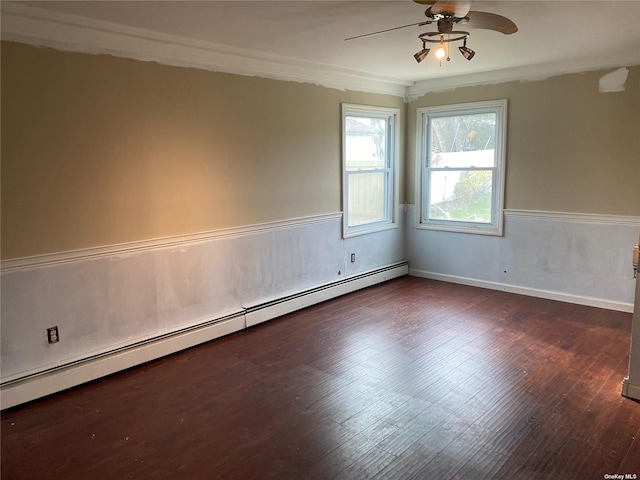 empty room featuring dark wood-style floors, a baseboard radiator, ornamental molding, and a ceiling fan