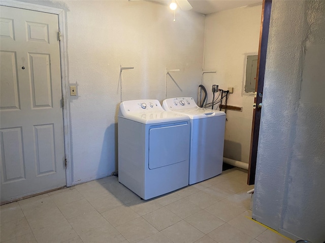 washroom featuring light tile patterned floors, laundry area, electric panel, ceiling fan, and separate washer and dryer