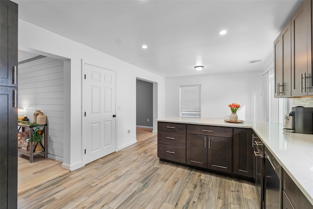 kitchen with light stone counters, recessed lighting, decorative backsplash, dark brown cabinets, and light wood-type flooring