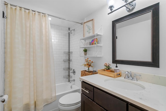 bathroom featuring vanity, shower / bath combination with curtain, and toilet