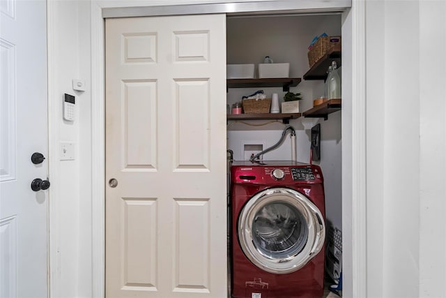 washroom with washer / dryer and laundry area