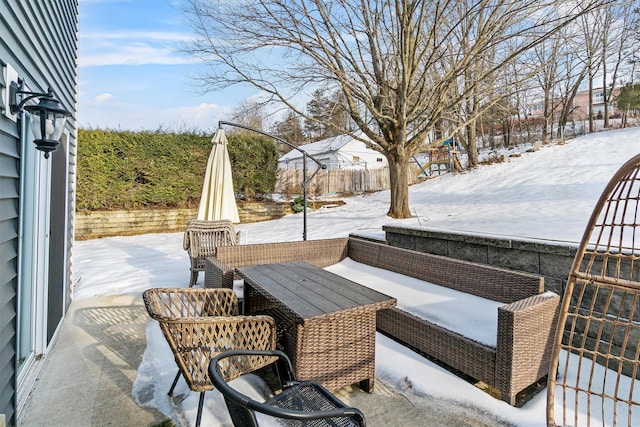 snow covered patio with fence