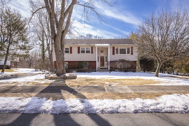 split foyer home with brick siding