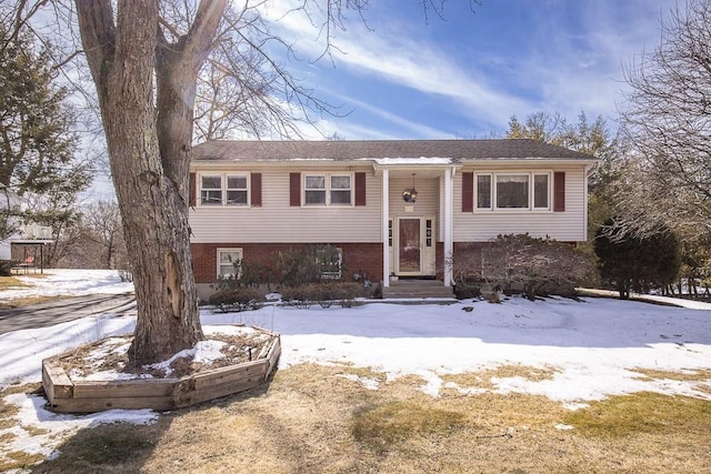 raised ranch with brick siding