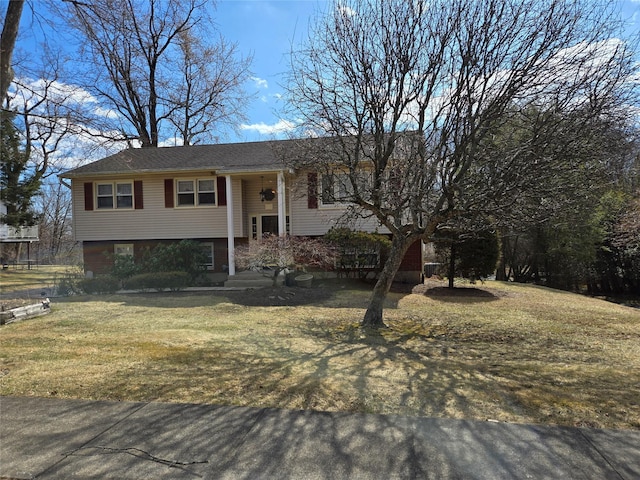 bi-level home featuring a front yard