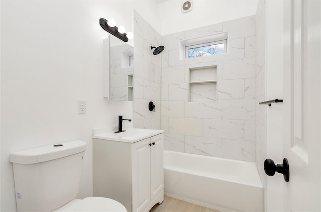 bathroom with shower / bath combination, vanity, and toilet