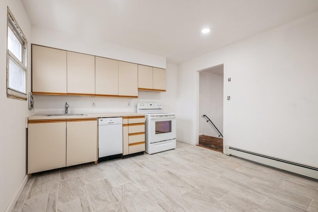 kitchen featuring white appliances, baseboard heating, cream cabinetry, light countertops, and a sink