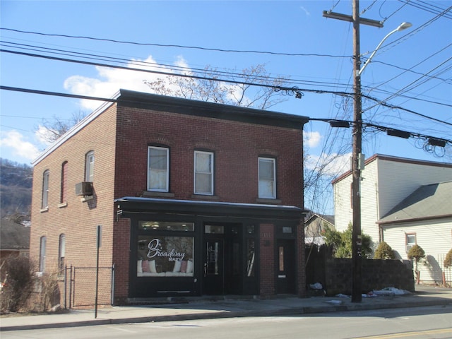 view of front of house featuring brick siding