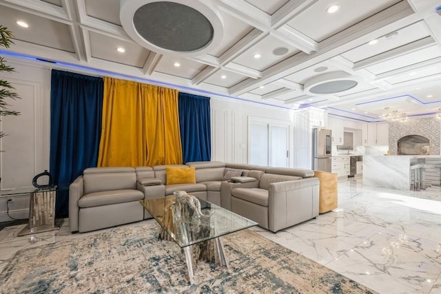 living area with marble finish floor, ornamental molding, and coffered ceiling