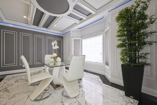 dining area with baseboards, coffered ceiling, ornamental molding, marble finish floor, and a decorative wall