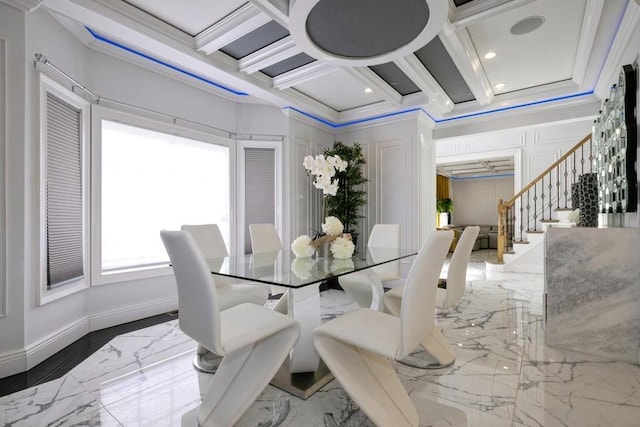 dining room featuring marble finish floor, crown molding, coffered ceiling, baseboards, and stairs