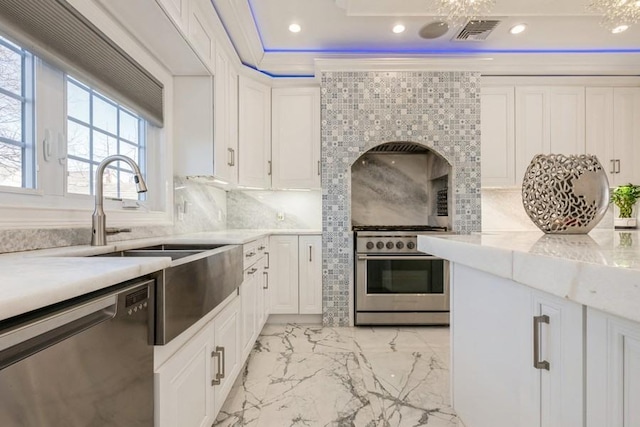 kitchen with visible vents, white cabinets, decorative backsplash, marble finish floor, and stainless steel appliances