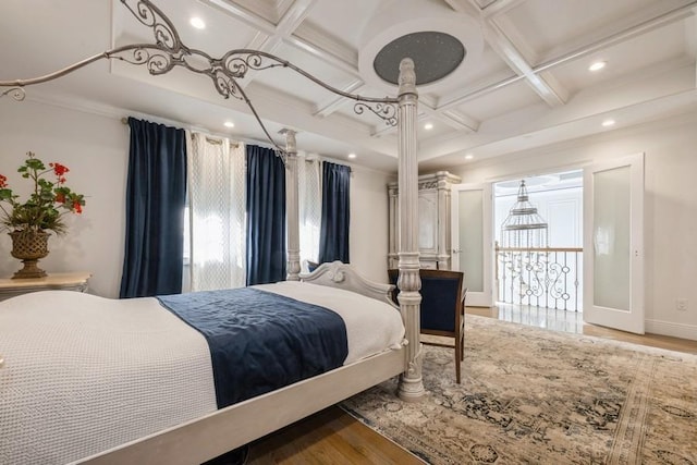 bedroom with baseboards, coffered ceiling, ornamental molding, wood finished floors, and recessed lighting