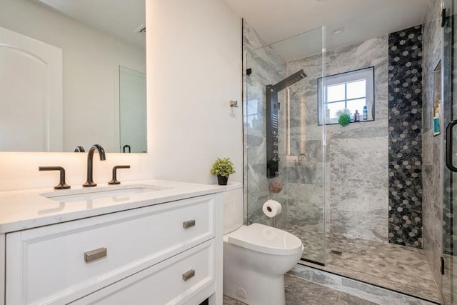 full bath with toilet, a shower stall, and vanity