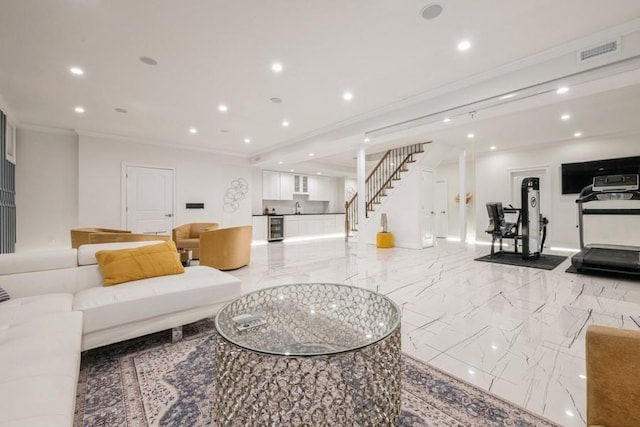 living room with marble finish floor, recessed lighting, visible vents, stairway, and ornamental molding