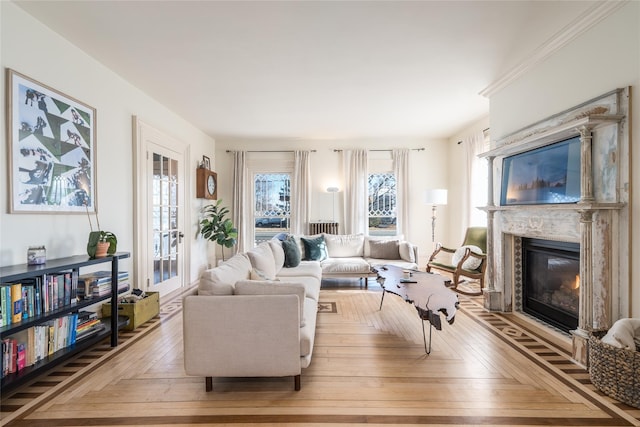 living area with a premium fireplace and a wealth of natural light